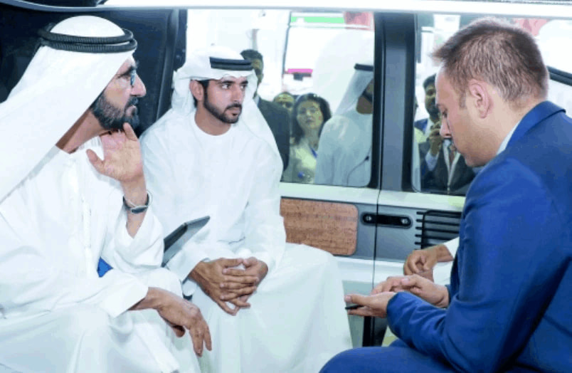 Leaders reviewing a technology demonstration during an institutional briefing